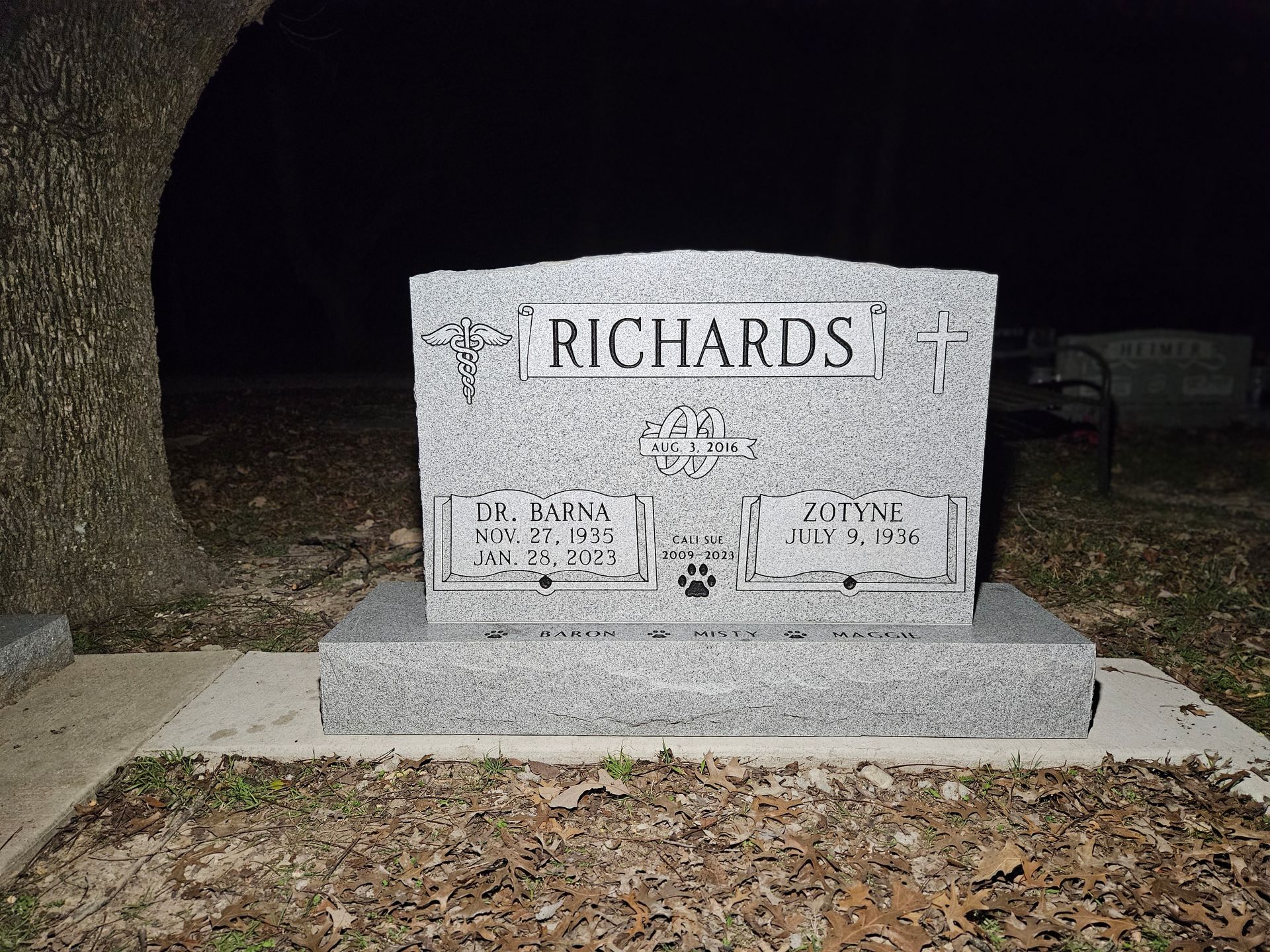 A gravestone in a cemetery with the name richards on it.
