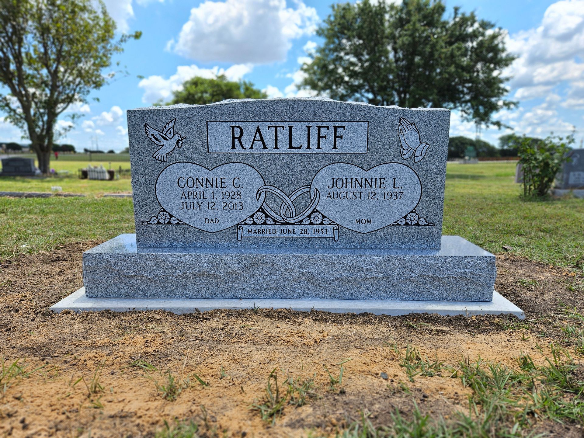 A gravestone in a cemetery with the name ratliff on it.
