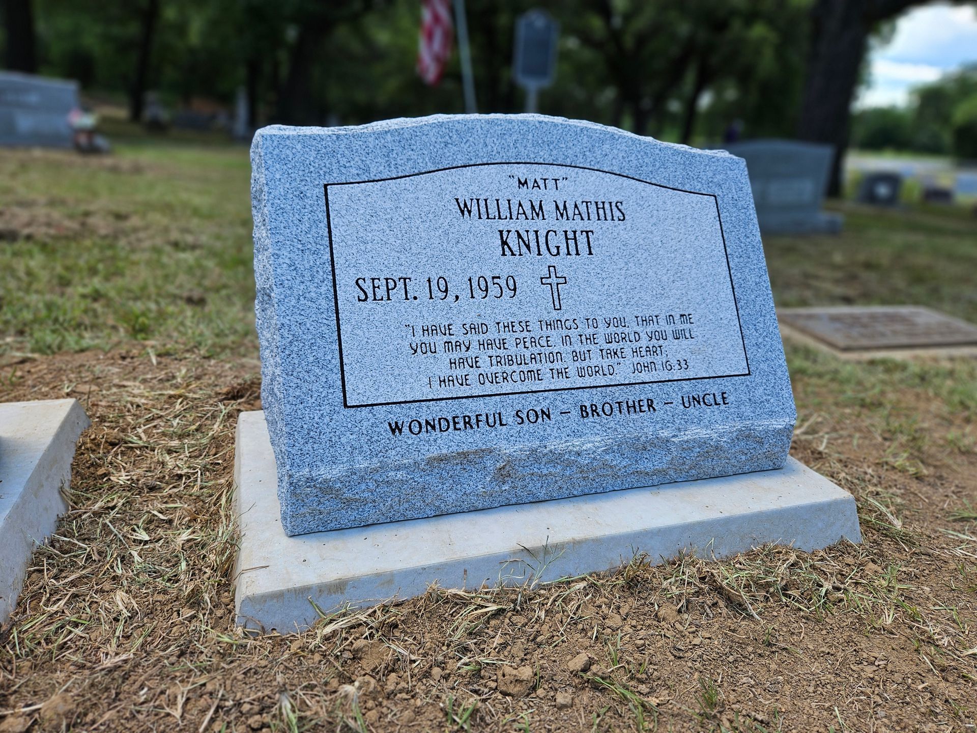 A gravestone in a cemetery with the name william wright on it