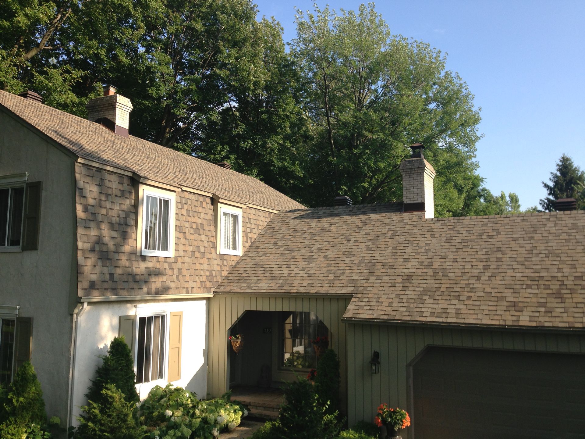 A house with a roof that has shingles on it
