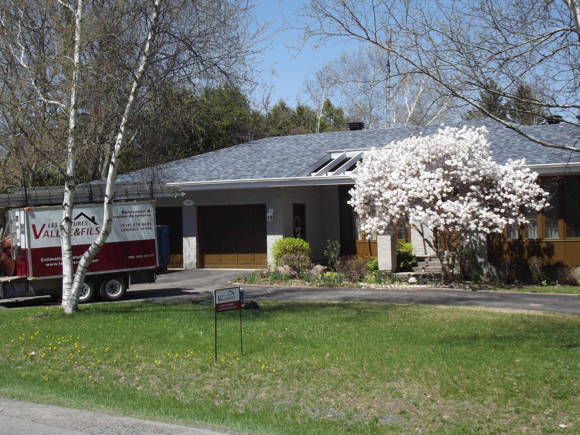 A house with a van parked in front of it