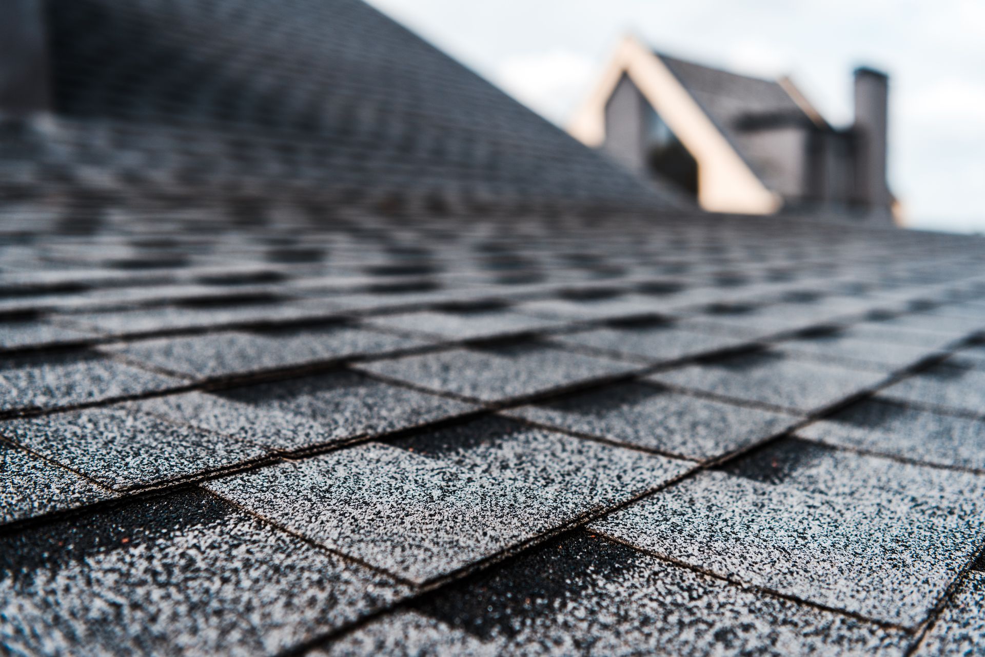 A close up of a roof with shingles on it.