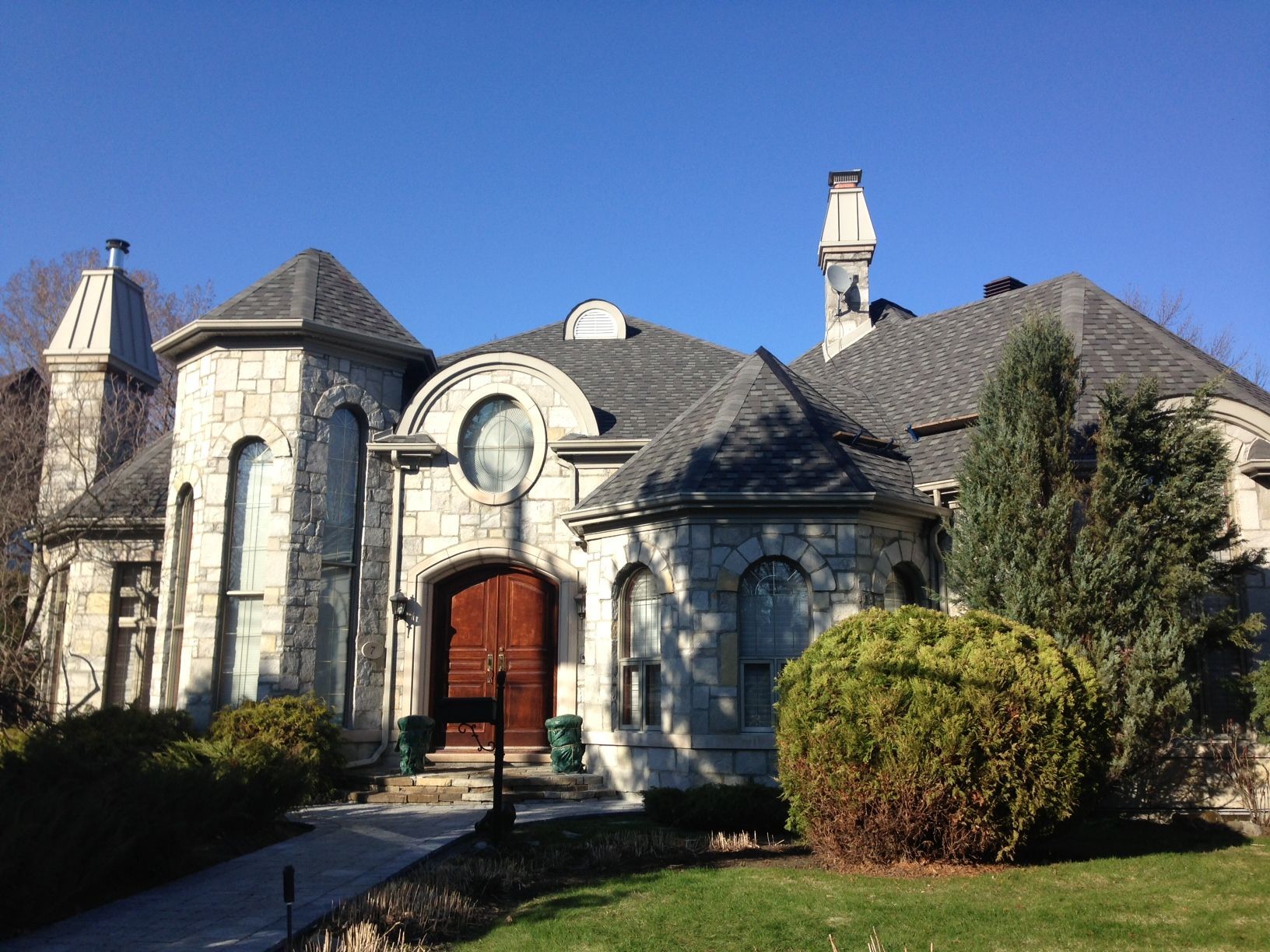 A large white house with a gray roof