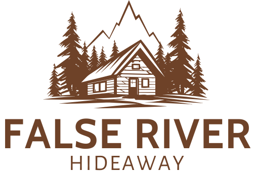 The logo for false river hideaway shows a log cabin surrounded by trees and mountains.