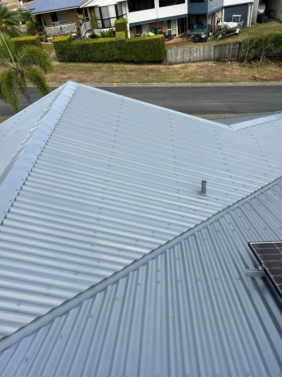 The Roof of A House with A Solar Panel on It — Darren Smith Painting Pty Ltd in Rural View, QLD