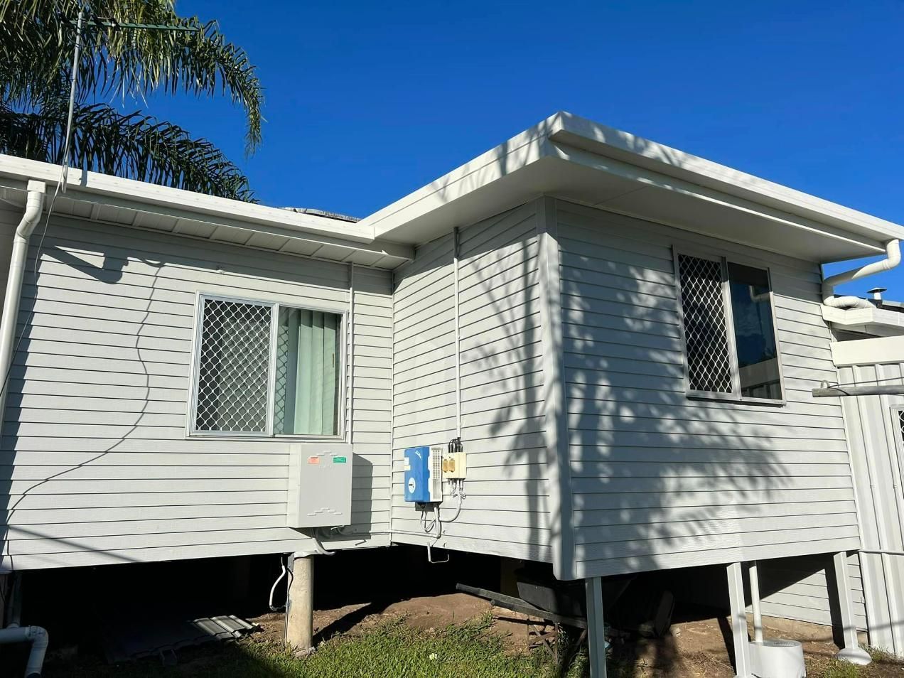 A White House with A Blue Sky in The Background — Darren Smith Painting Pty Ltd in Northern Beaches, NSW