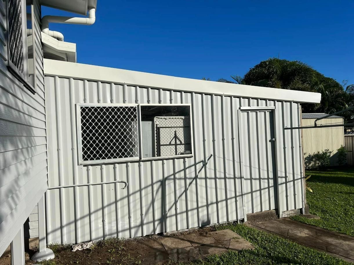 A White Shed with A Window on The Side of It — Darren Smith Painting Pty Ltd in Northern Beaches, NSW