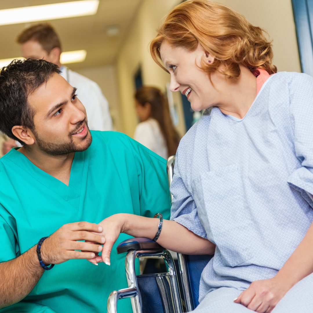 male nurse with woman in wheel chair