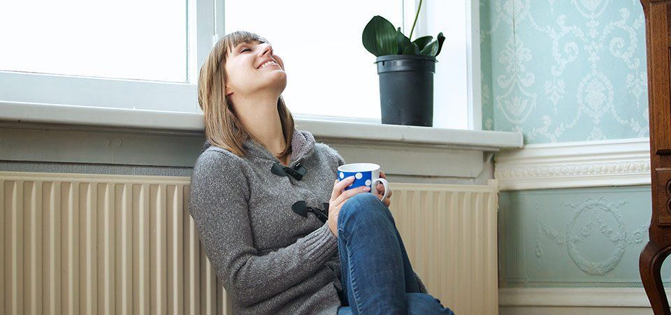 woman relaxing in warm home