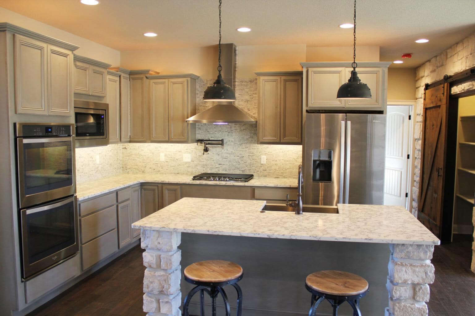 Custom Kitchen with marble surface by Timberwood Homes