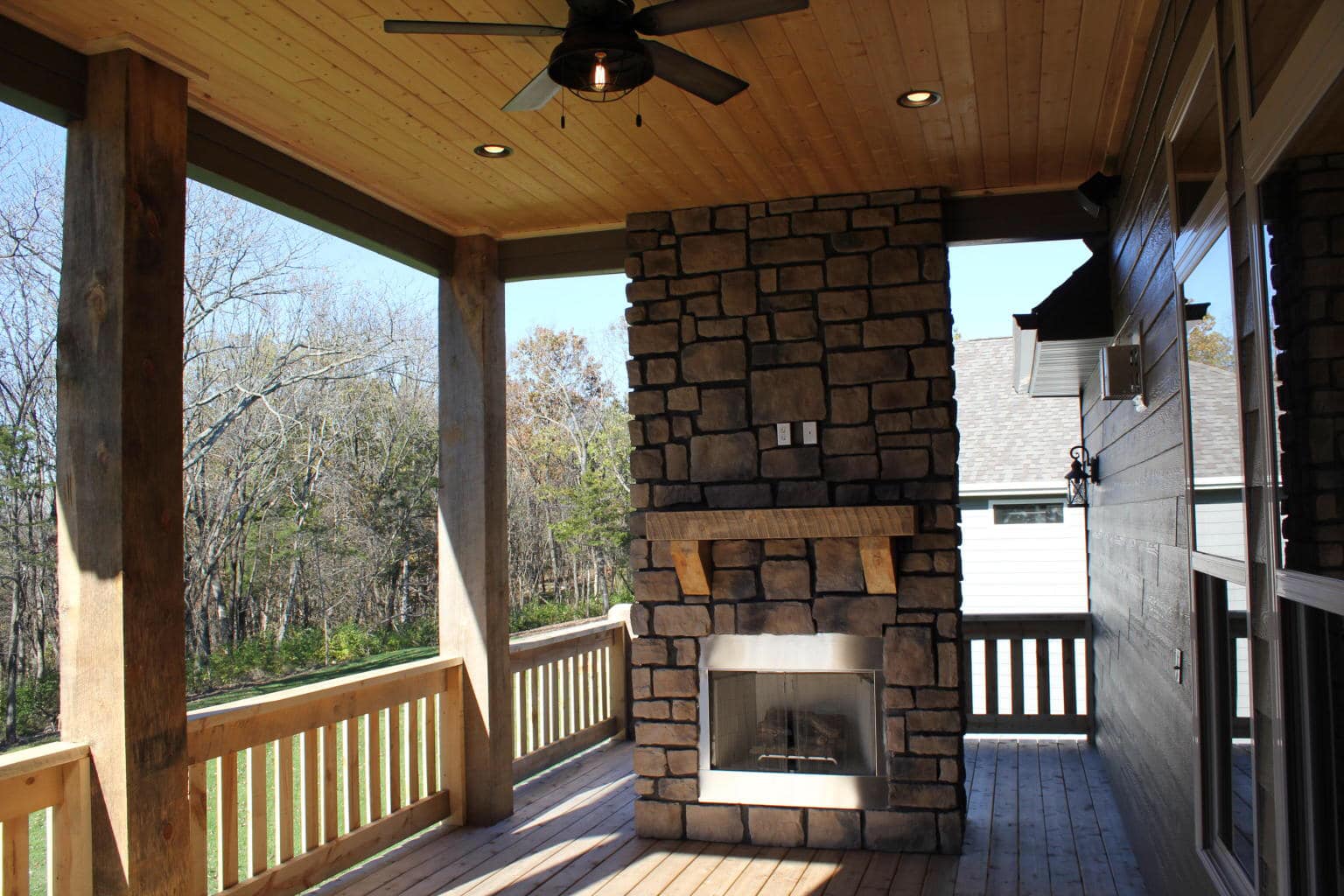 Timberwood Homes Outdoor Space with Fireplace