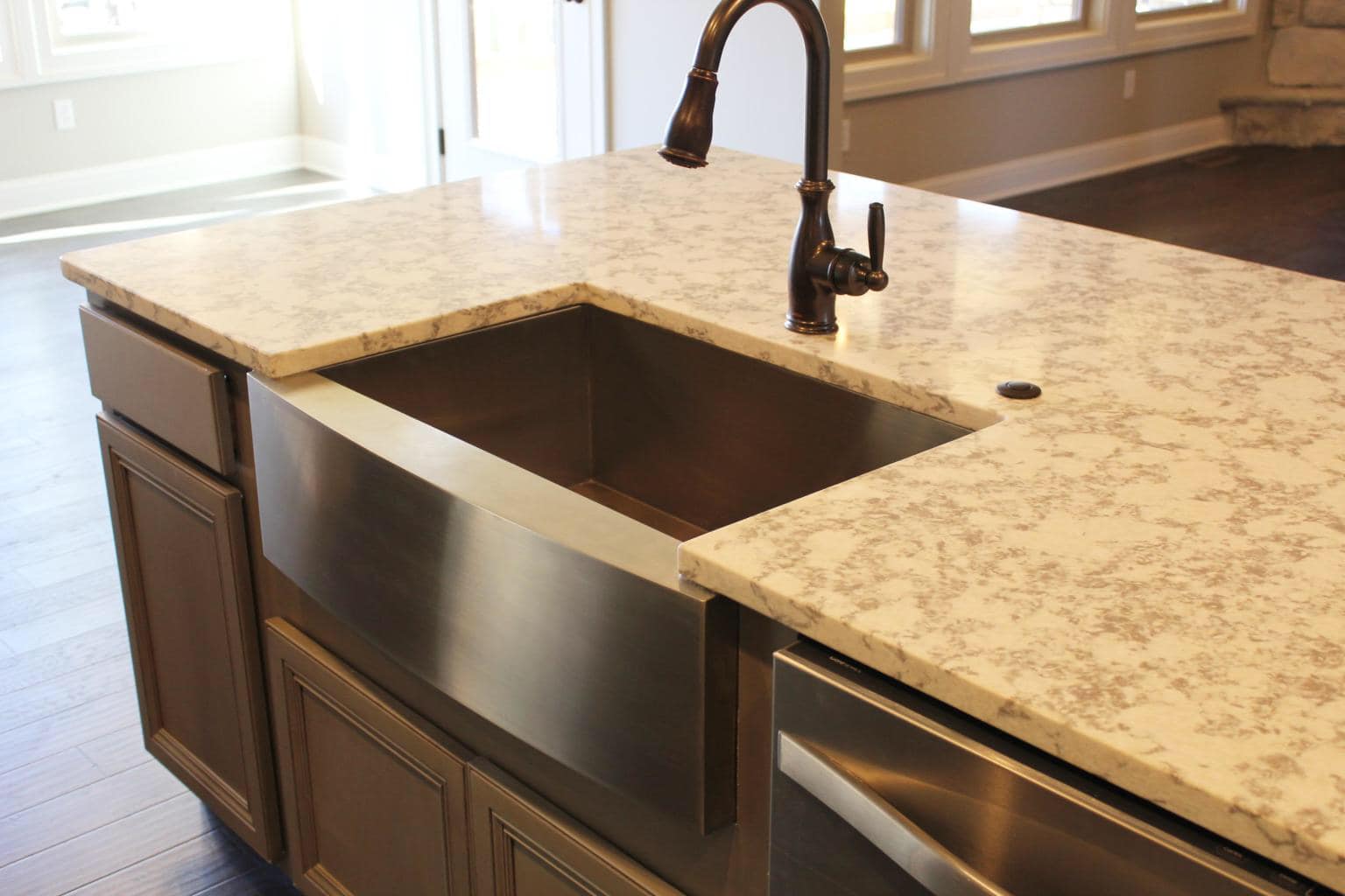 Close-up of Kitchen Remodel with sink and marble surface by Timberwood Homes