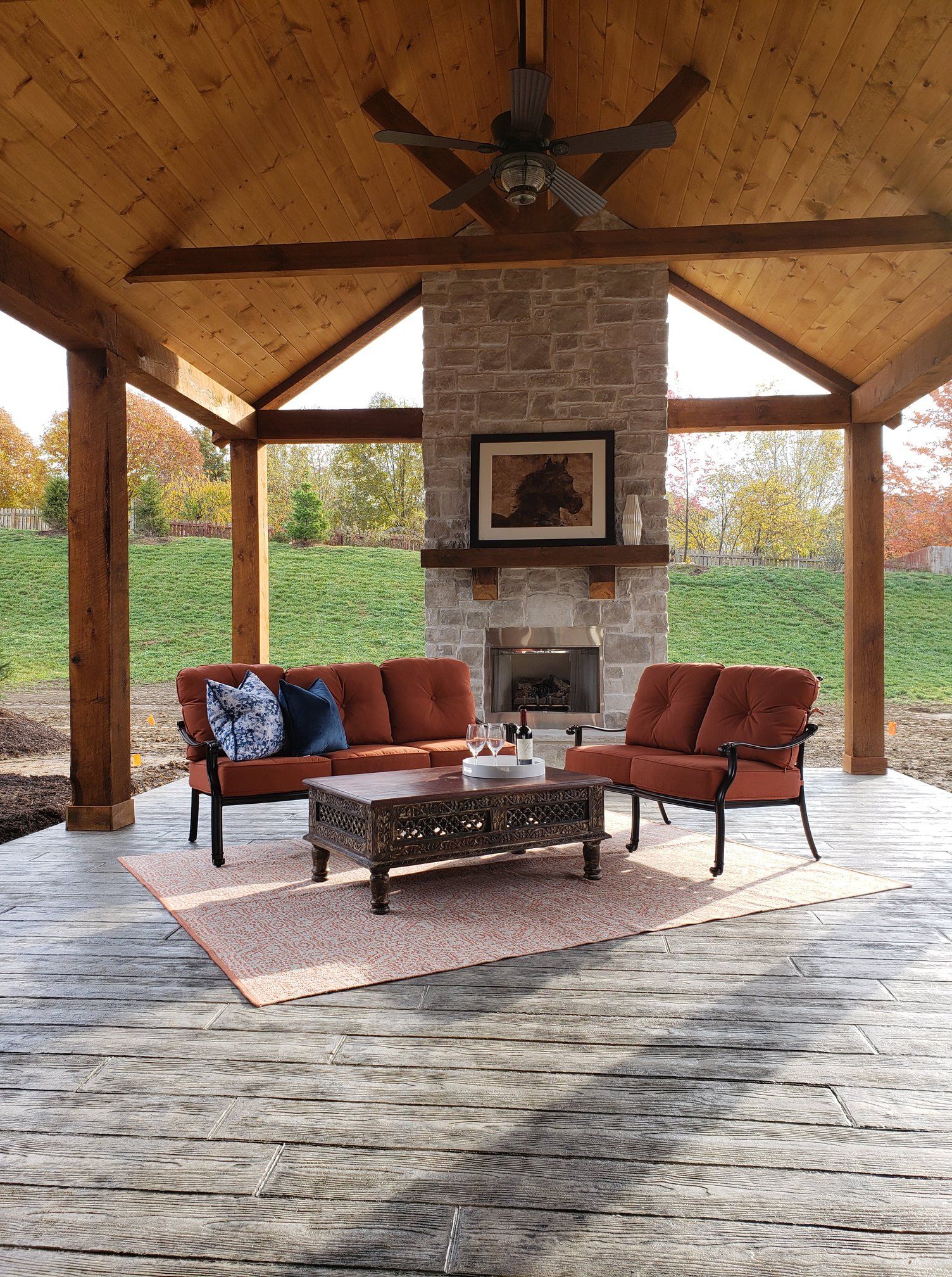 Outdoor Living Space with fireplace by Timberwood Homes