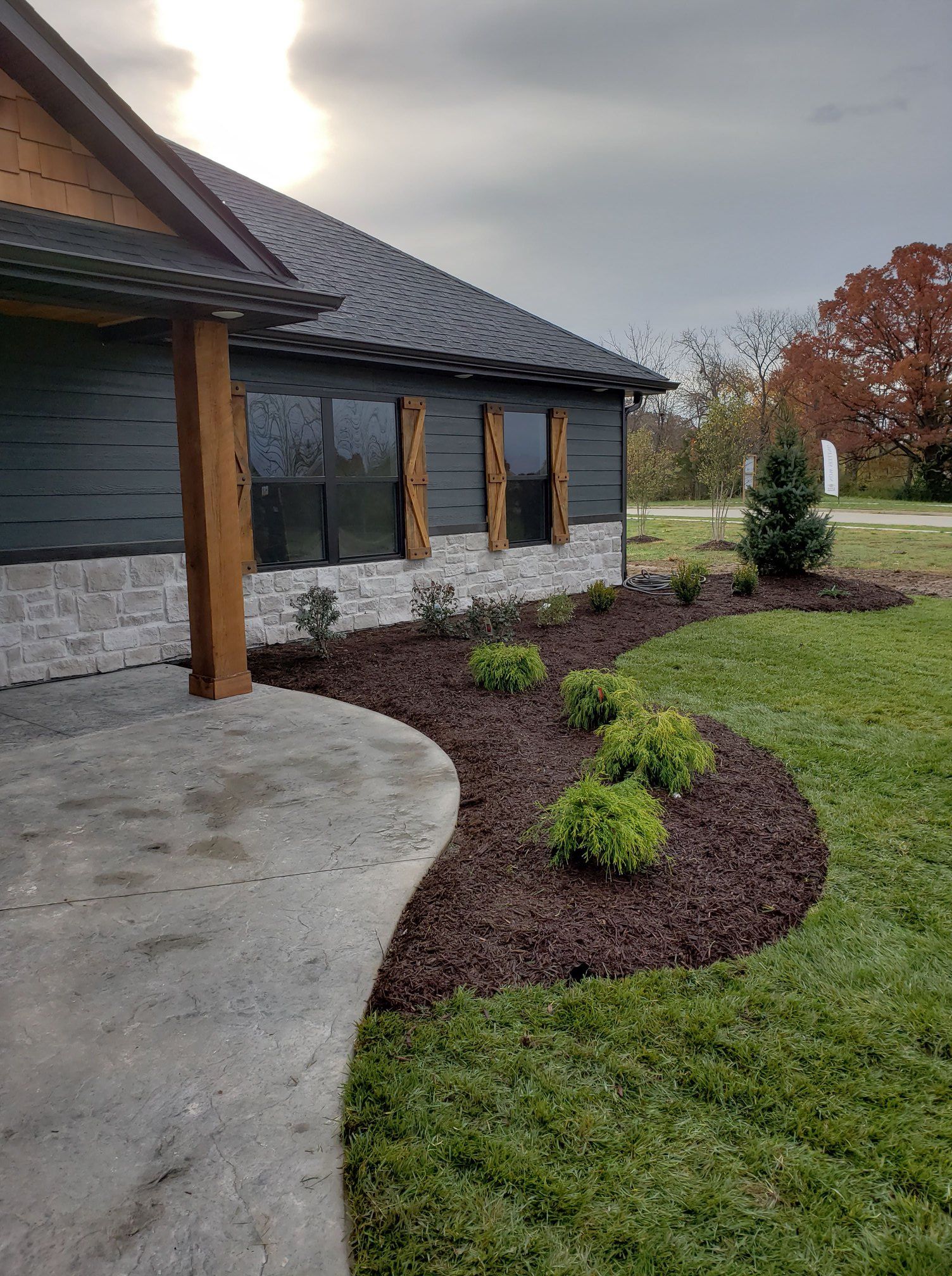 Custom Home Remodel with front yard by Timberwood Homes