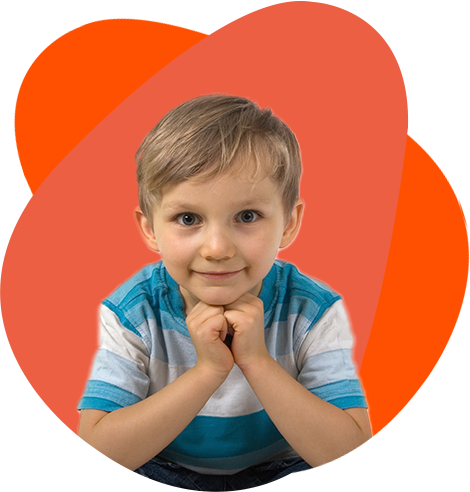 Smiling young boy with hands under chin, against orange background. Smiling young boy with hands under chin, against orange background.