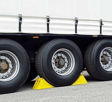 Yellow Chocks On Wheel — Transport Products in Toowoomba, QLD