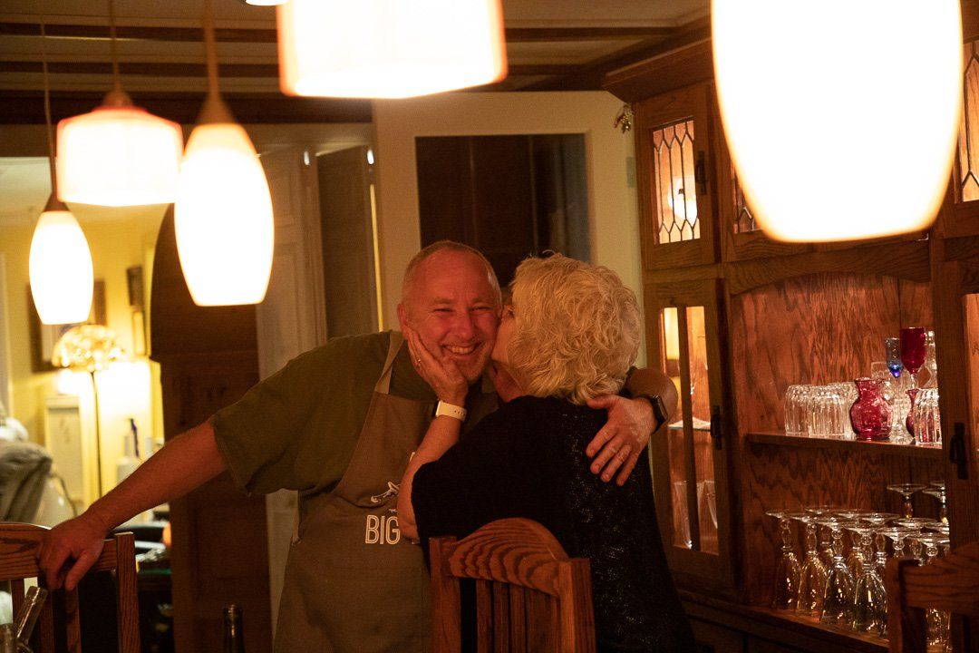 A happy guest kisses Chef Rob