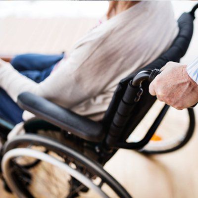Woman On A Wheel Chair — Meriden, CT — Thompson, O’Connor & Associates, LLC