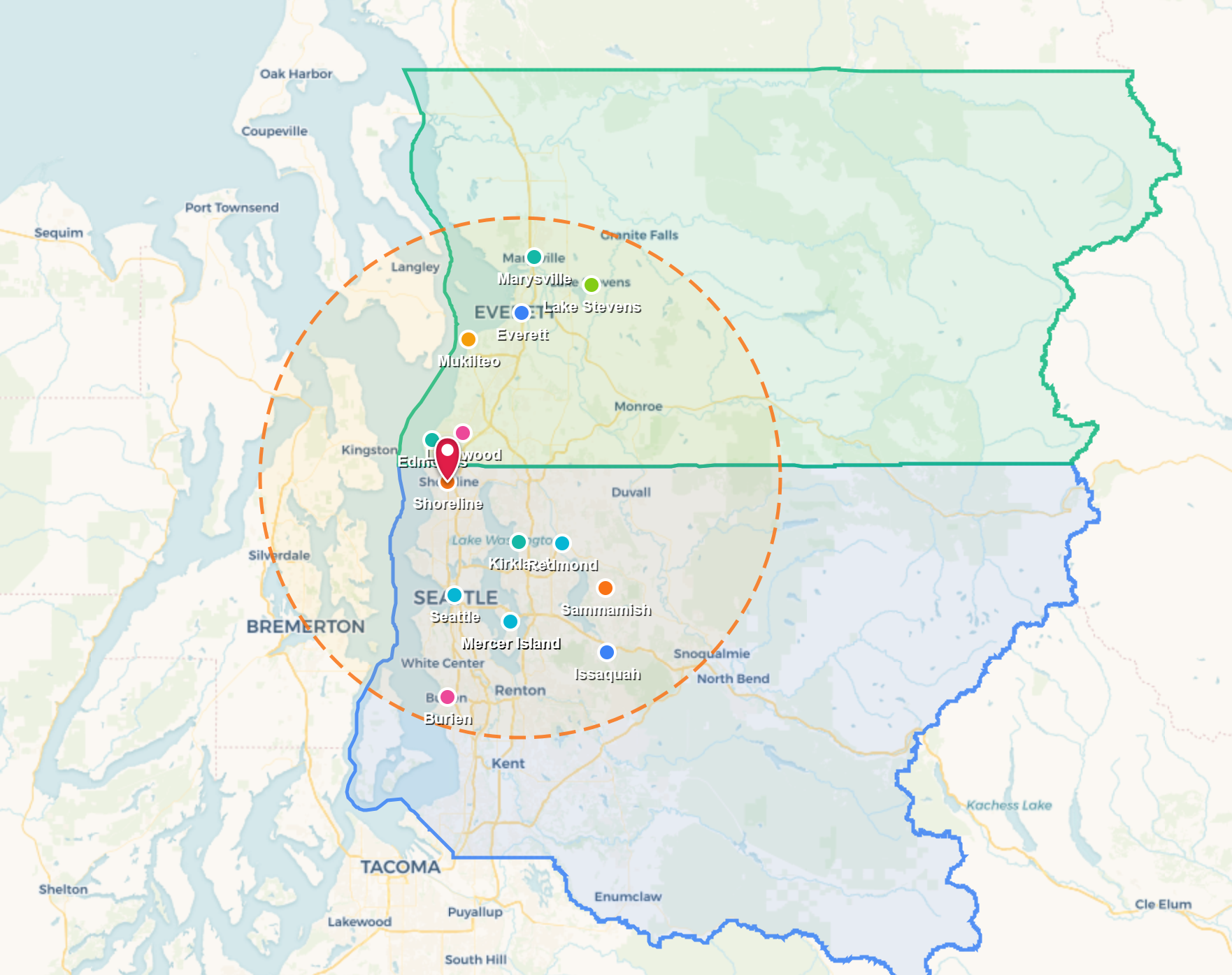 Map with a green and blue outlined region, clustered markers, and a dashed circular area around central locations