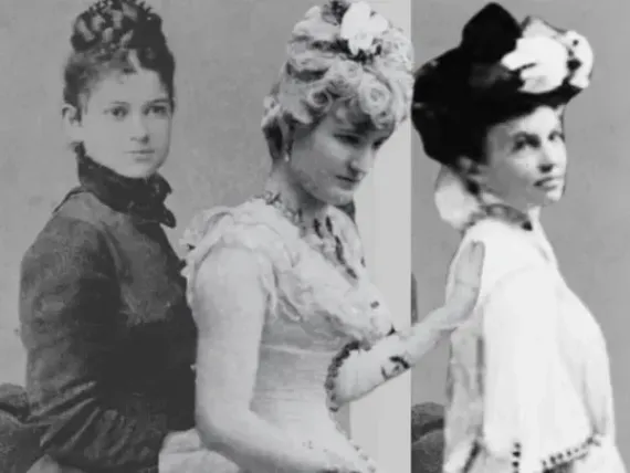 Three women are standing next to each other in a black and white photo