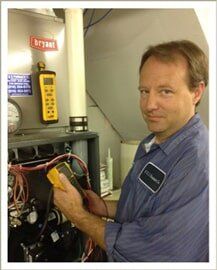 Man holding a tester — AC Repair in Independence, MO
