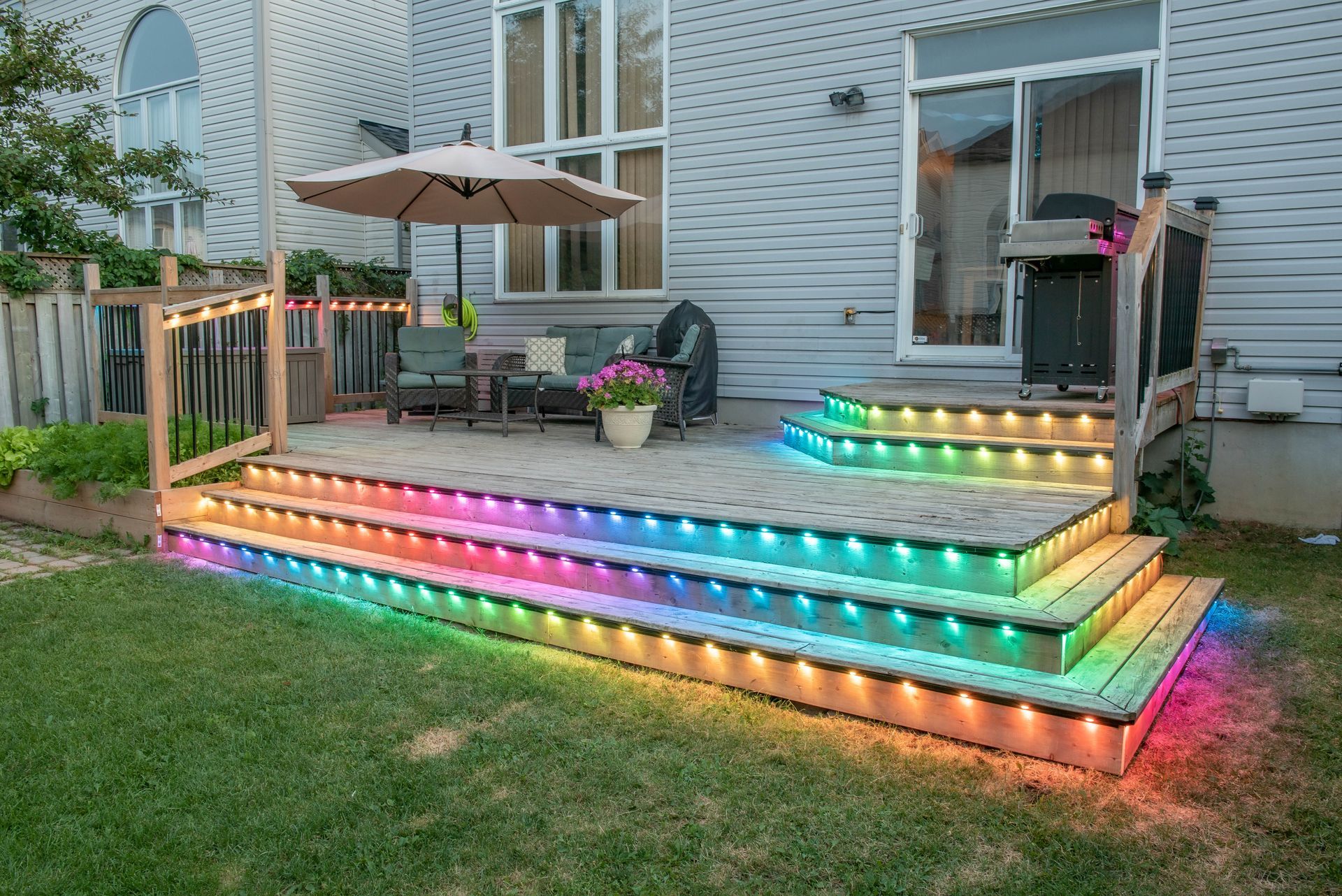 A deck with a rainbow of lights on it