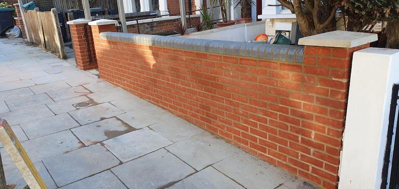 Brick walls by West London Paving