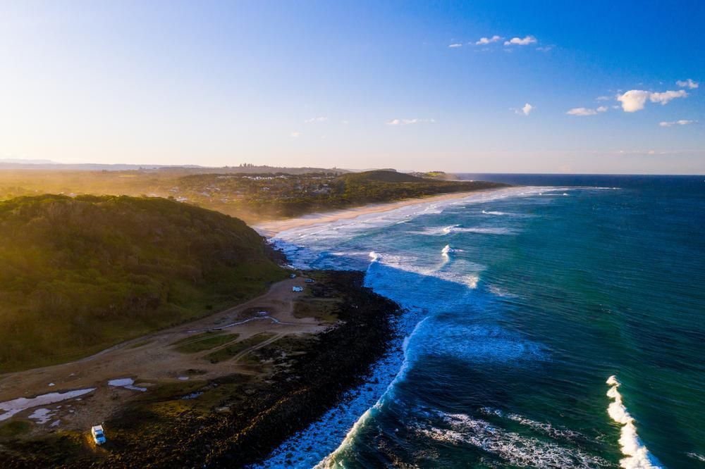 Aerial View of a Beach and Ocean at Sunset — Seal Tite in Ballina, NSW