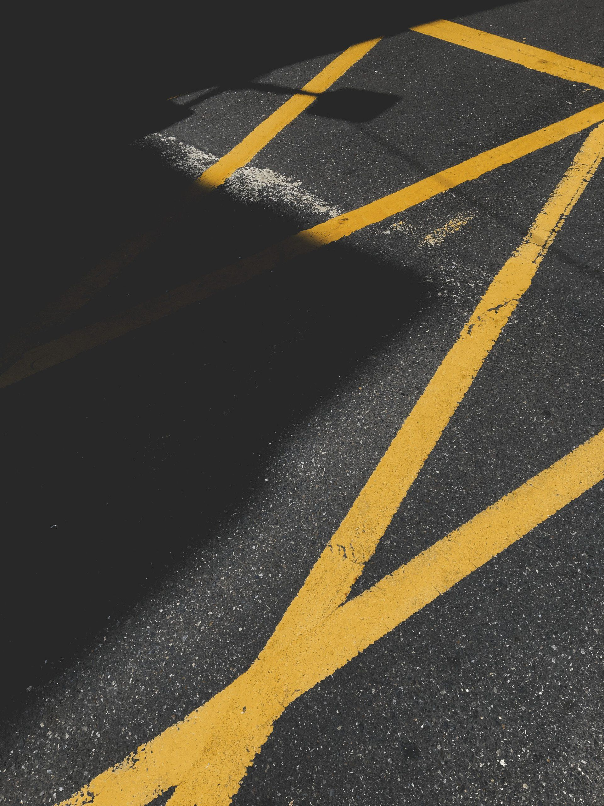 A close up of a yellow line on the road