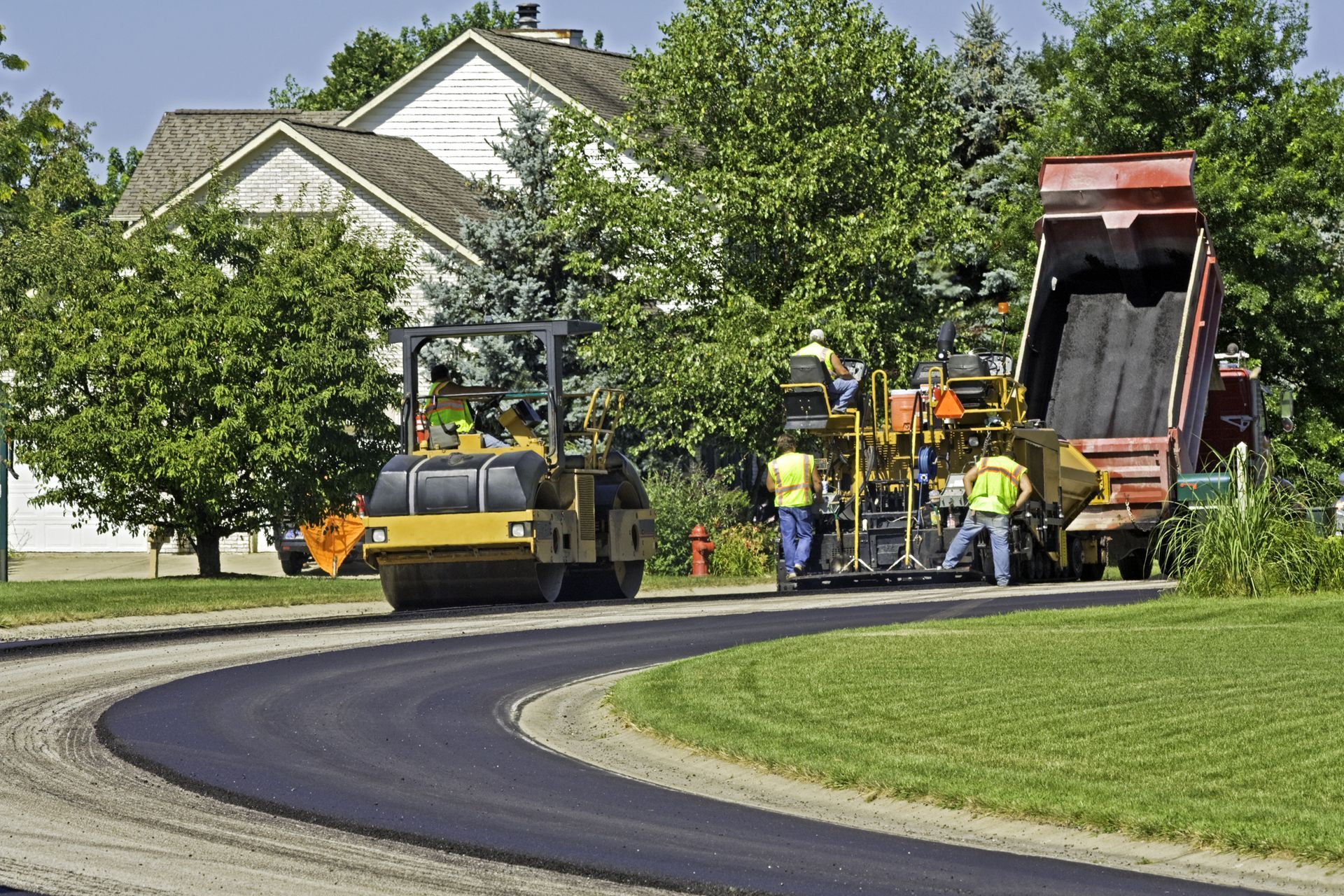 A road is being paved in a residential area