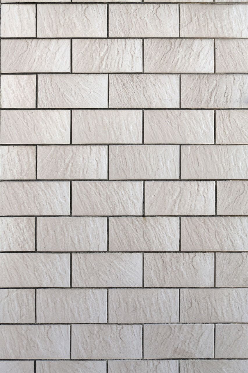 A close up of a white brick wall.