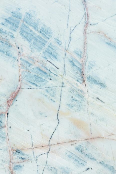 A close up of a white and blue marble texture.