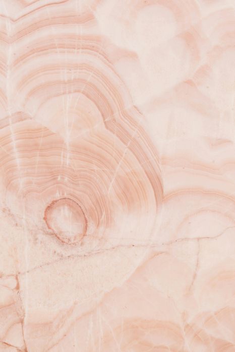 A close up of a piece of pink marble.