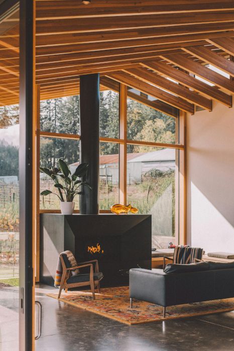 There is a fireplace in the middle of the living room.