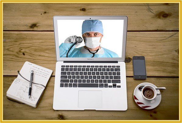 a macbook air laptop with a doctor on the screen