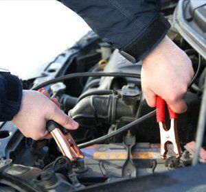 Mechanic checking power supply of car in Nampa, ID