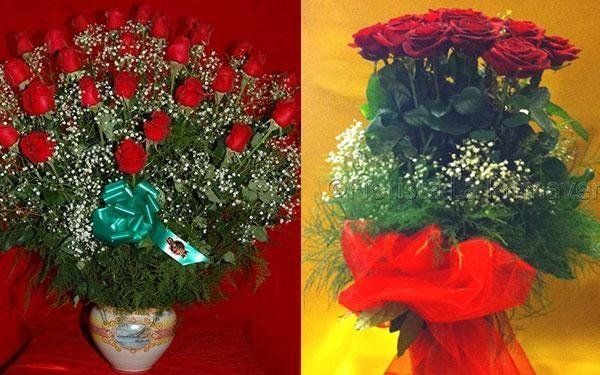 composizione floreale con fiorellini bianchi e rose rosse
