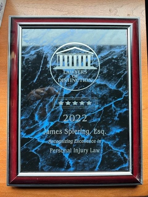 Plaque awarded to James Spiering, Esq., in 2022 by Lawyers of Distinction for outstanding excellence in Personal Injury Law.