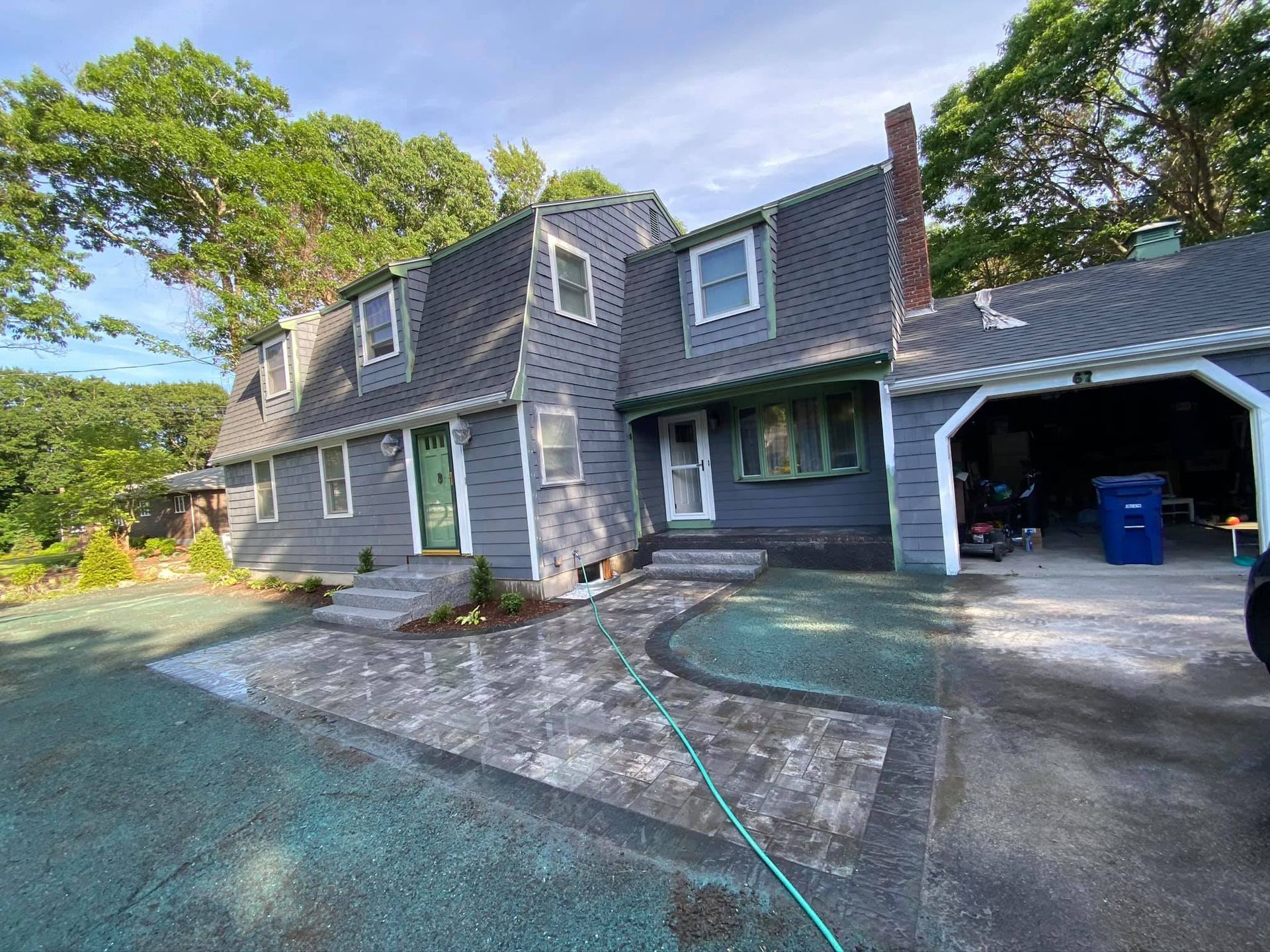 A large house with a car parked in front of it.