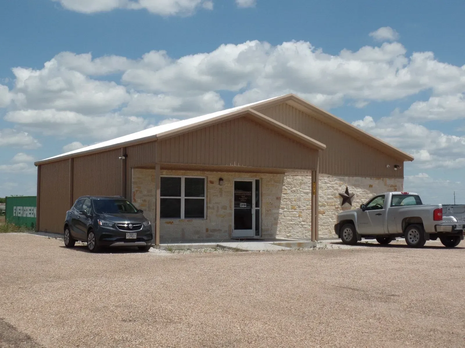 Two Cars Are Parked In Front Of Building - Clifton, TX - Bosque Supply Company
