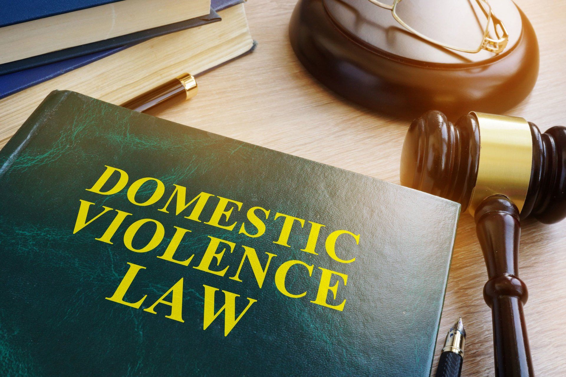 Domestic Violence Attorney — Book With Pen And Gavel On A Table in Fort Smith, AR