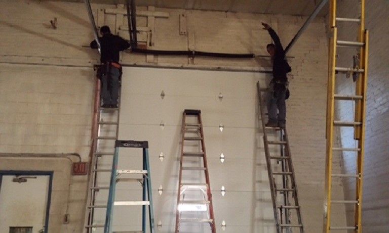 people working on garage