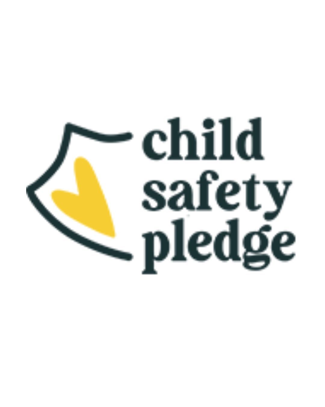 A logo for the child safety pledge with a heart on it