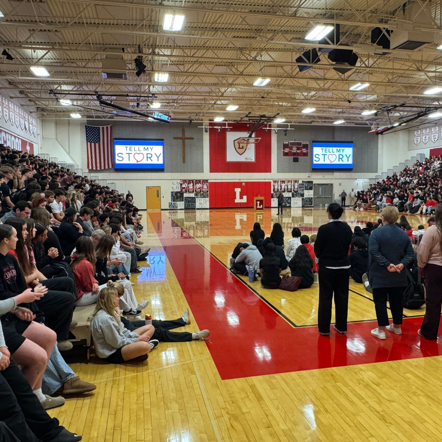 A video camera shows a group of people sitting at tables