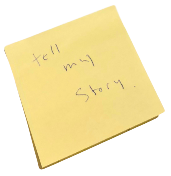 A yellow sticky note that says tell my story