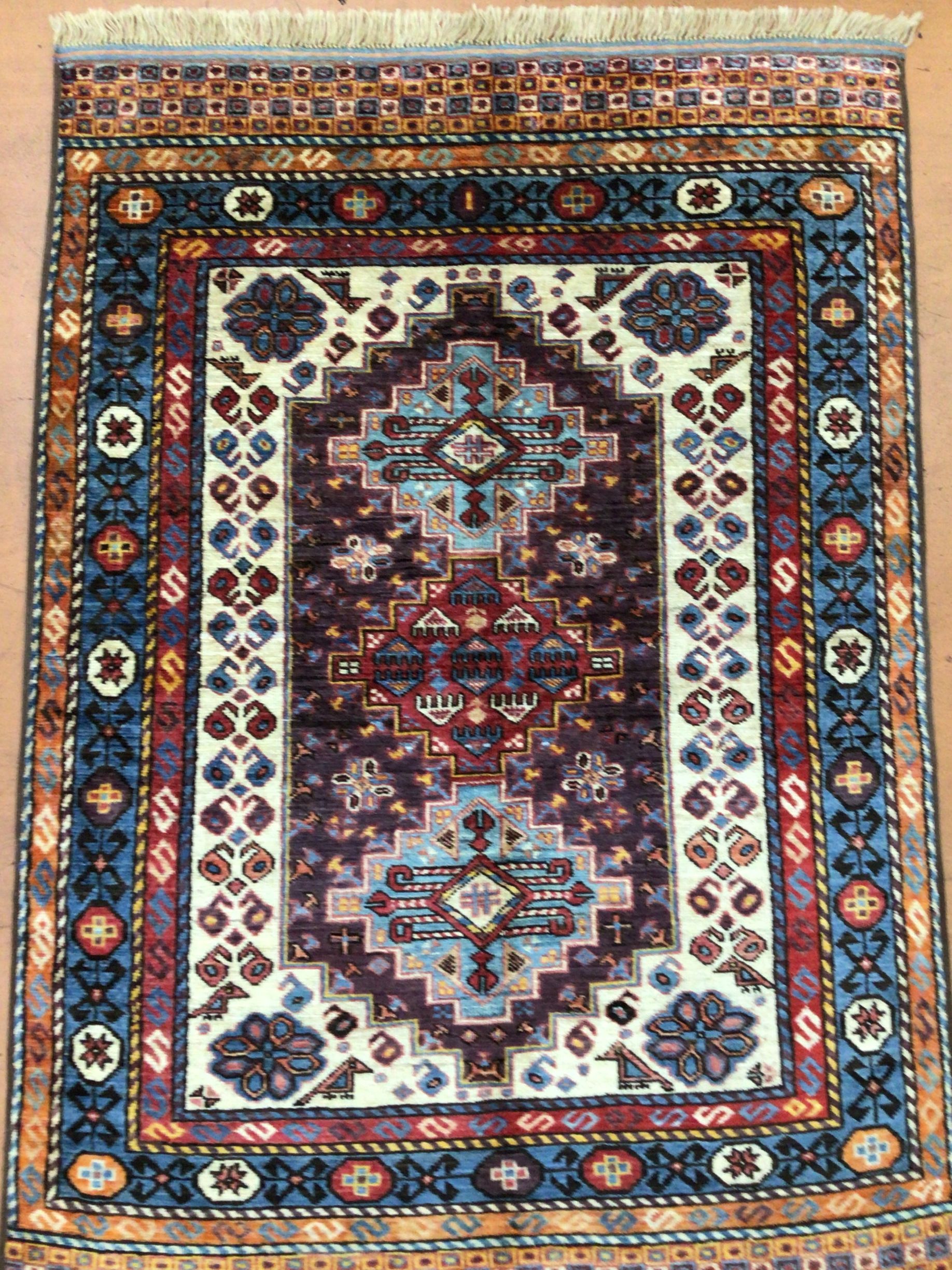 A colorful rug with a geometric pattern on it