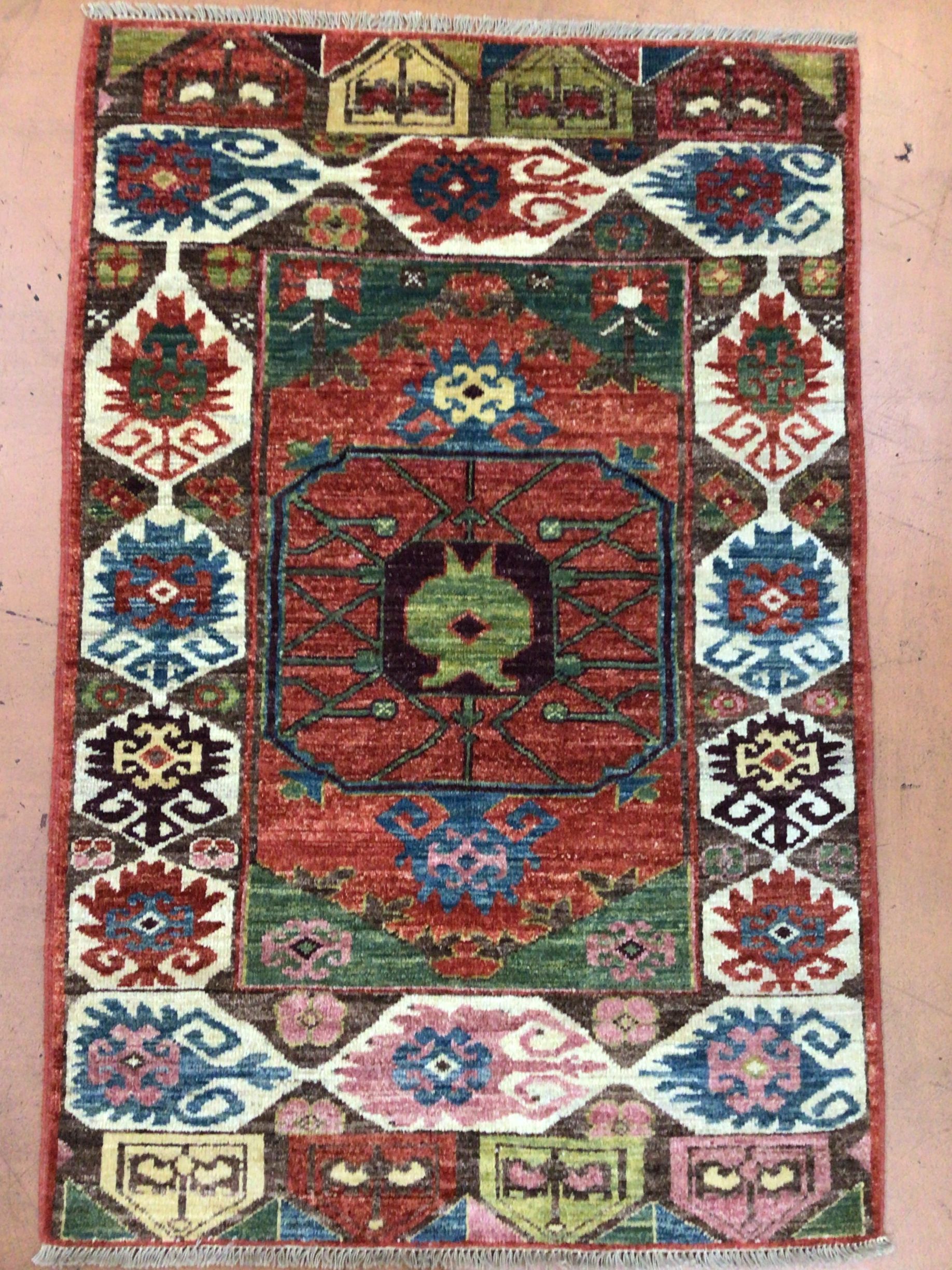 A rug with a floral pattern is sitting on a table.