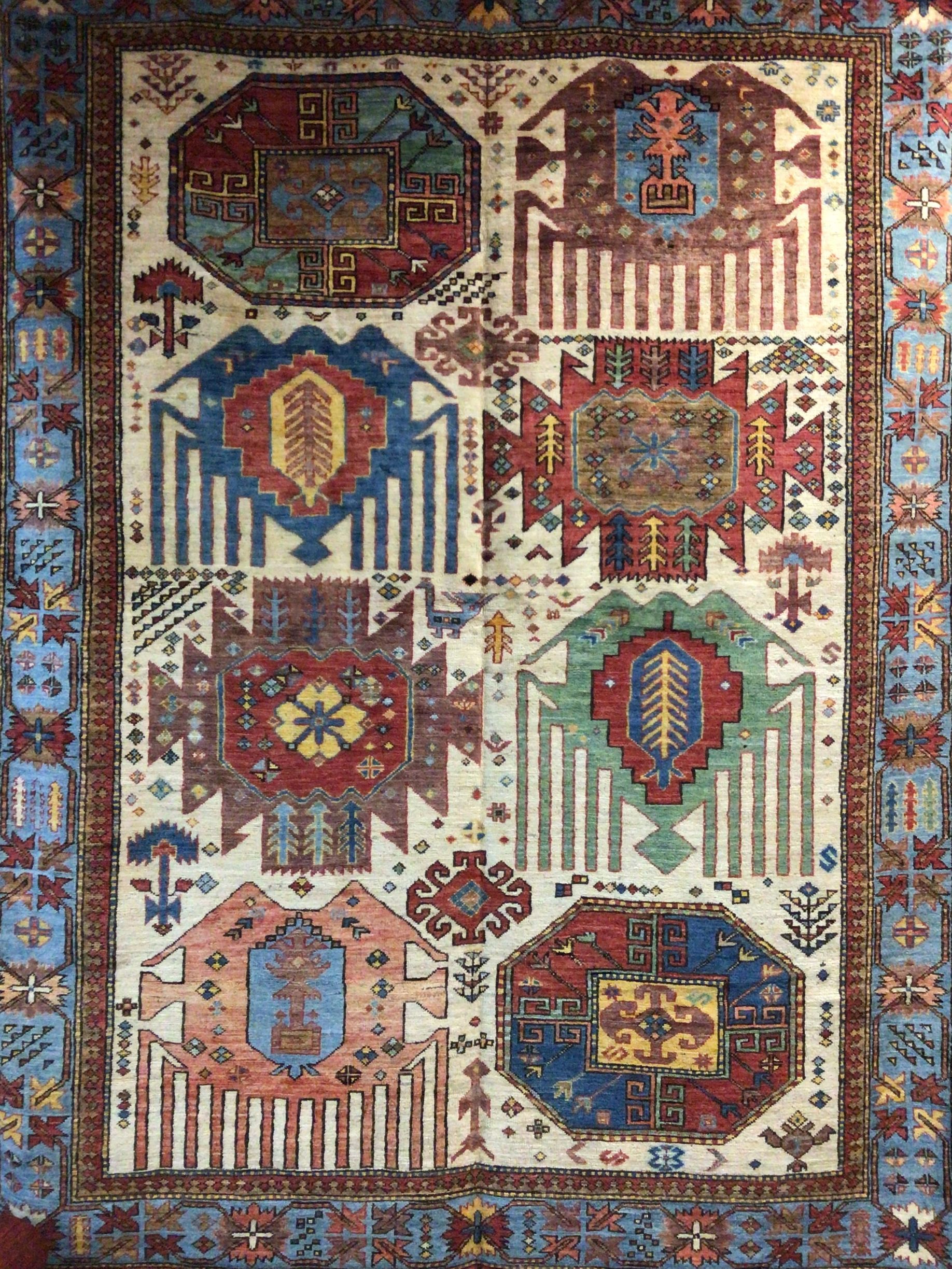 A rug with a lot of different designs on it