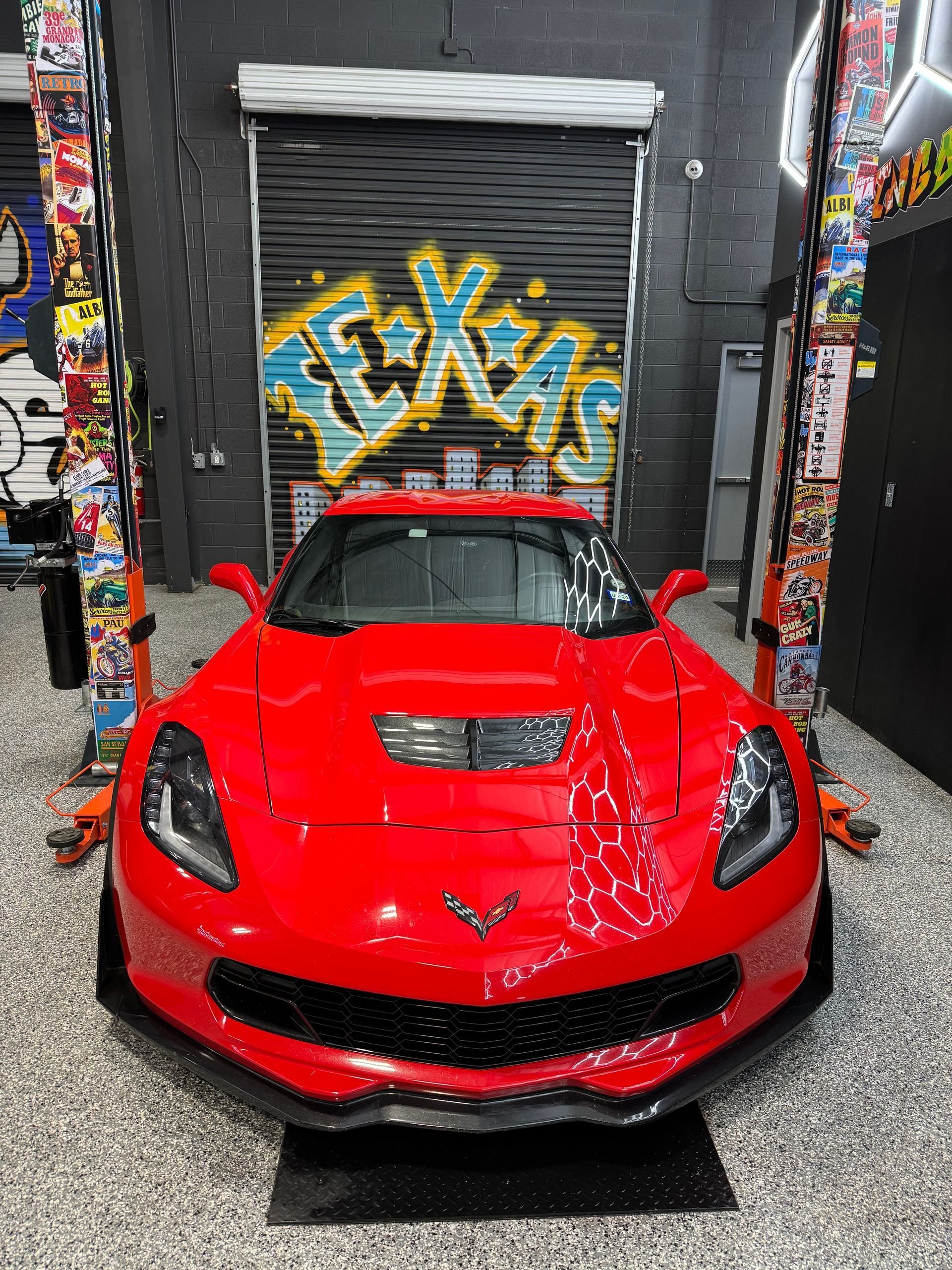 Red Corvette in garage with