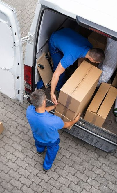 Two Delivery Men Are Loading Boxes Into A Van — Port Stephens Removals & Storage In Nelson Bay, NSW